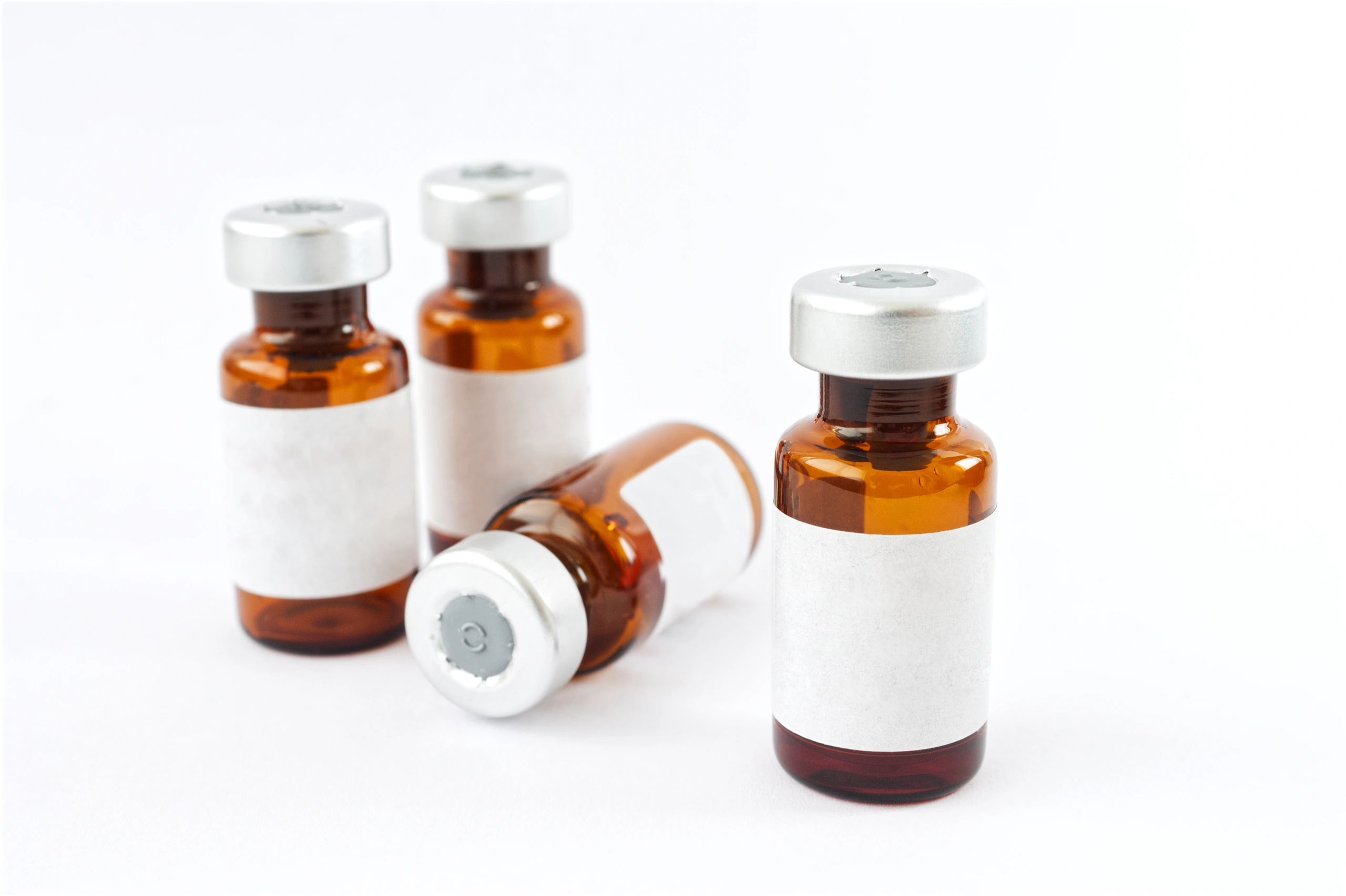 Amber peptide vials on a white background